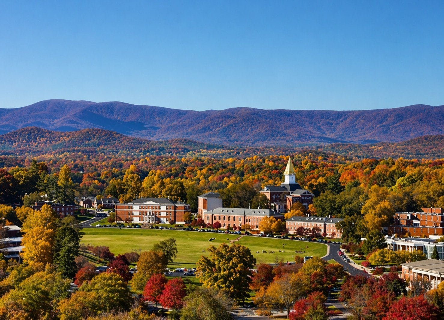 Dahlonega, GA campus surrounded by colorful autumn trees and scenic mountain backdrop.
