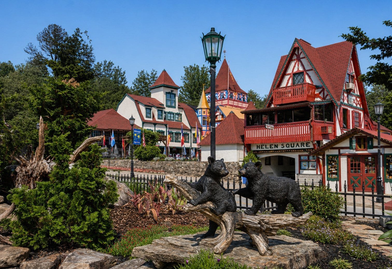 Helen Square in Cleveland, GA featuring charming Bavarian-style buildings and bear statues.