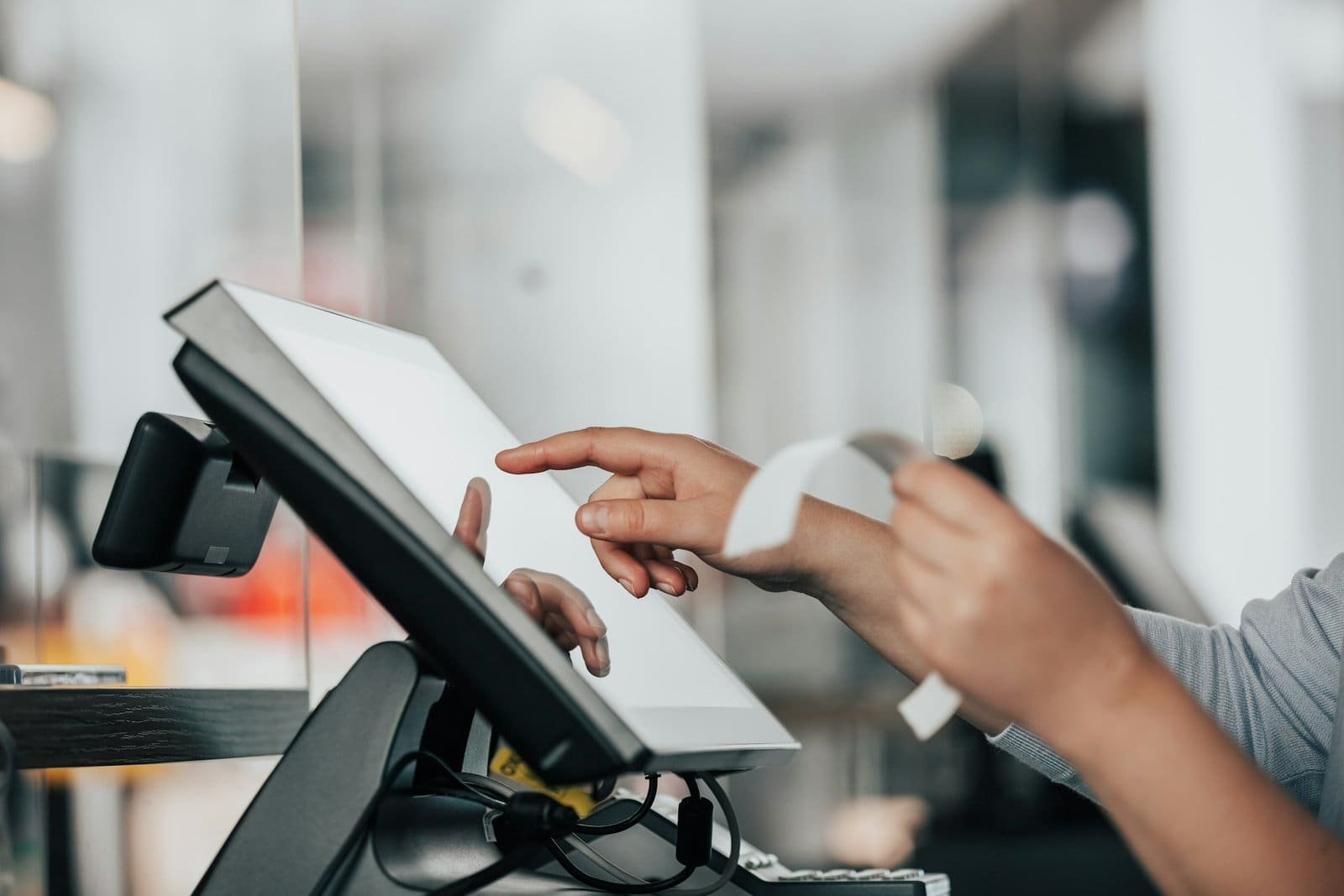 Touchscreen POS system used in restaurants for efficient order and payment handling.
